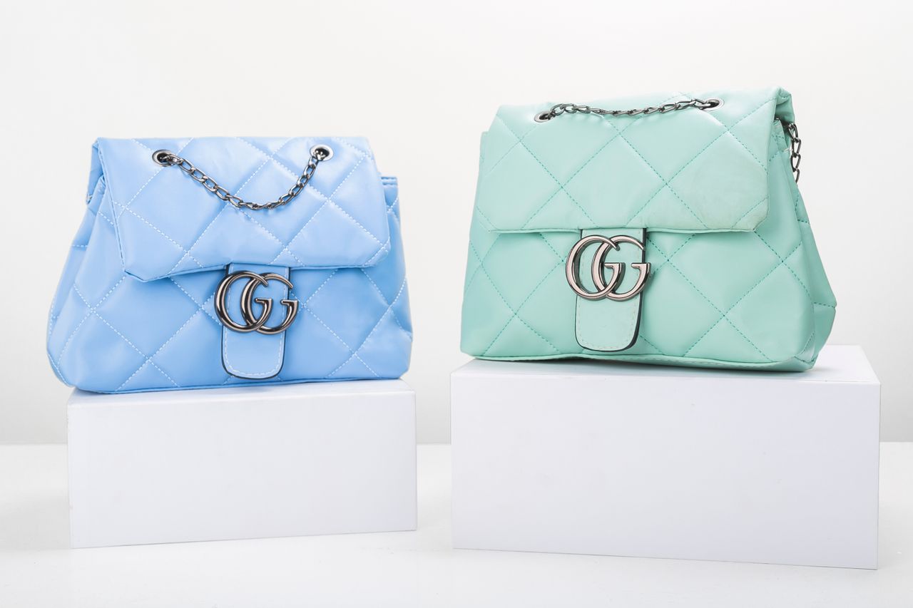 Crafting Captivating Headlines: Your awesome post title goes here Stylish blue and mint quilted handbags on display, perfect for fashion enthusiasts.